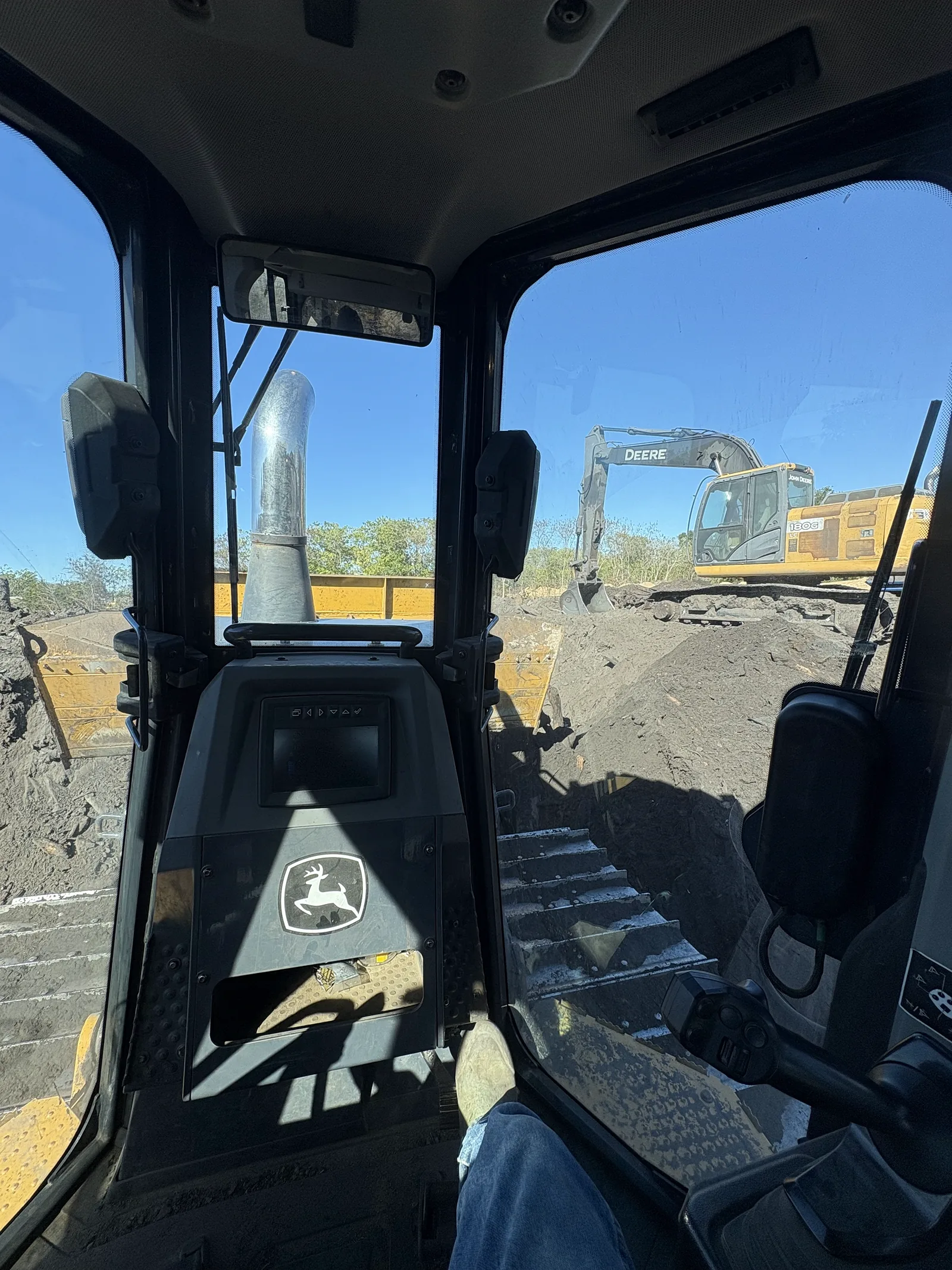 Inside the cab of a John Deere dozer on a JGH Enterprises jobsite near Starke, Florida